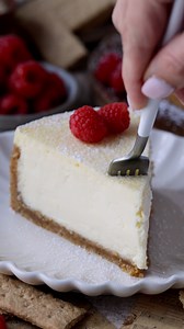 This classic New York Cheesecake is a creamy, decadent dessert that boasts a buttery graham cracker crust and a rich, velvety filling. Perfect for any occasion, this cheesecake is sure to impress with its smooth texture and delightful flavor. ❣ Check out this amazing recipe here: https://www.piesandtacos.com/new-york-cheesecake/ | Pies and Tacos