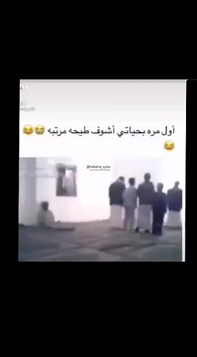 Traditional Gathering of Men in White Robes