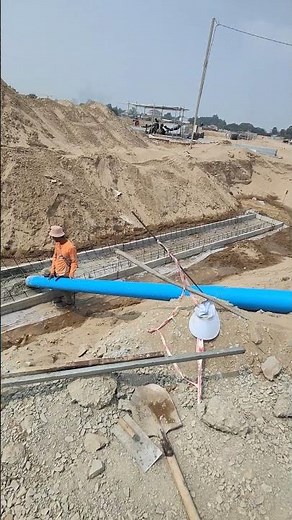 Casting concrete with PVC pipe for base of drainage