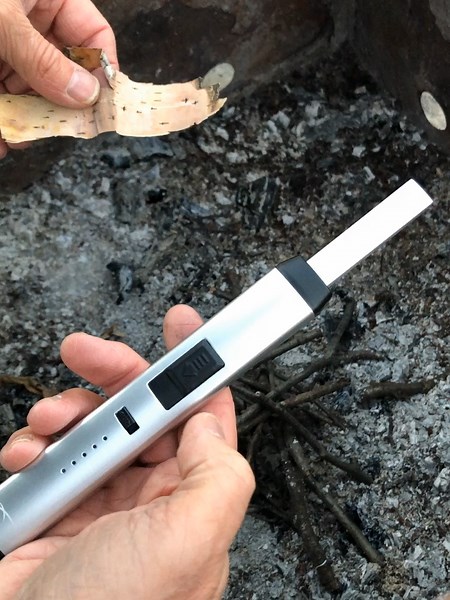 Windproof fire starting 🔥 The Sizzle Pitmaster plasma lighter makes ignition easy. #SizzlePitmaster #FireTok #CampingGear #FireStarter #PlasmaLighter #OutdoorTools #CampingLife #FirePit #Campfire #SurvivalGear #BackyardFire