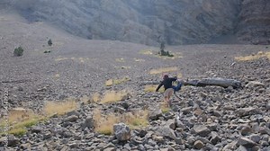 Mountain Hike: Children take a leisurely stroll in the mountains, navigating hilly trails. It's a summer family retreat amidst the mountainous beauty. The youngsters participate in outdoor games
