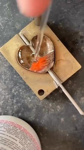 Every Beach Art Glass piece starts here, hand-shaped molten Murano glass, made by me in the heart of the UK. No two ever the same. No mass production. Just fire, glass, and imagination. Gift something no one else in the world will have this Christmas. https://beachartglass.com/collections/frosted-sea/products/frosted-sea-heart-pendant . . #beachartglass #lampworkjewellery #handmadejewellery #glassjewellery #gifting #statementjewellery | Beach Art Glass