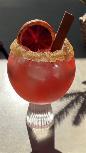 Save this to your holiday hosting ideas! ❤️ INGREDIENTS: 2 oz valencia orange tequila 1 oz 100% cranberry juice 1 oz blood orange juice 3/4 oz orange liqueur 1/4 oz agave 3/4 oz lime juice Rim: agave turbinado sugar Garnish: blood orange slice cinnamon stick METHOD: Prepare your glass by rimming with agave turbinado sugar and set aside. Add tequila, cranberry juice, blood orange juice, orange liqueur, agave, and lime juice into a shaker with ice and shake well. Strain over fresh ice into rimmed 