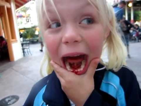 Losing her first tooth at Disneyland!