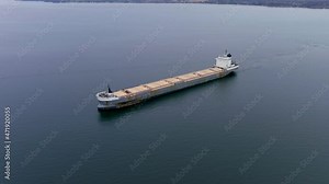 High quality, 4K aerial view of a cargo ship navigating the St Lawrence Seaway, Canada.