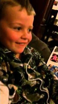 Little boy making car engine sounds