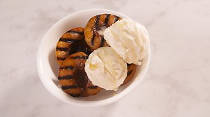 Grilled Peaches are the perfect dessert for your next BBQ. Full recipe: http://dlsh.it/yZArUOt | Delish