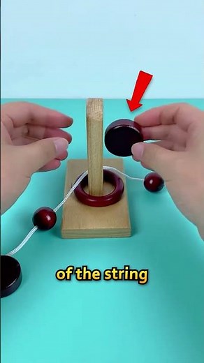 How to Solve the Ring and String Puzzle