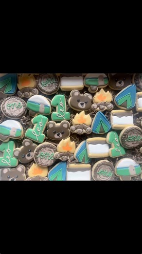 How cute is this camping themed order for a first birthday? These cake pops were a challenge for me but they turned out so cute… and added bonus… they’re s’mores flavored! | Elliott's Sweet Boutique