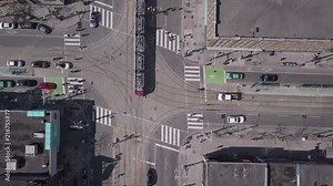 Aerial birds eye view footage of a streetcar(tram) in Toronto