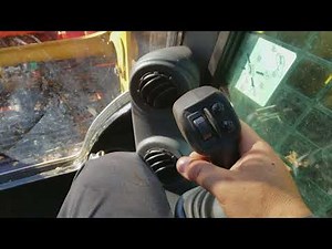 CAT 259D with grapple attachment.