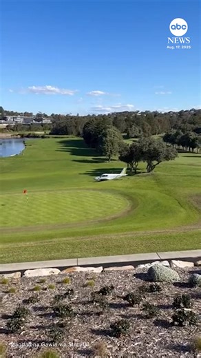 An eyewitness captured the dramatic moment a small plane crash-landed onto a golf course in Sydney, Australia, after it lost power. Both people aboard the plane escaped without serious injury, and no bystanders were hurt, officials said. https://abcnews.visitlink.me/7mUAMw | ABC News