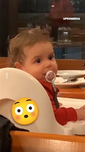 This little girl couldn't take her eyes off the handsome young man who sat near her. 🤭 | Positive