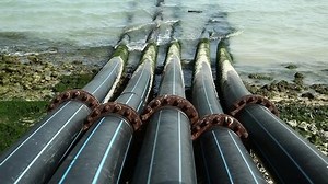 Pipes for intake of sea water and desalination in Doha, Qatar. Desalinization of sea water for city needs, water intake from Persian Gulf, Arabian Peninsula, Middle East