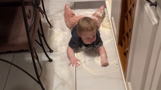 Little one creates a comical flour disaster while his mom was distracted