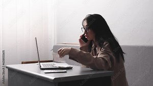 Desperate frustrated bank customer emotionally talking on the phone. Facing fraud, cost overruns, online payment problems, credit card blocking, bankruptcy.