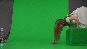 Full-size side view green screen chroma key video of a posessed female, woman figure, ghost, poltergeist, zombie crawling over an obstacle. The ring reference. Chroma key. Stock Video