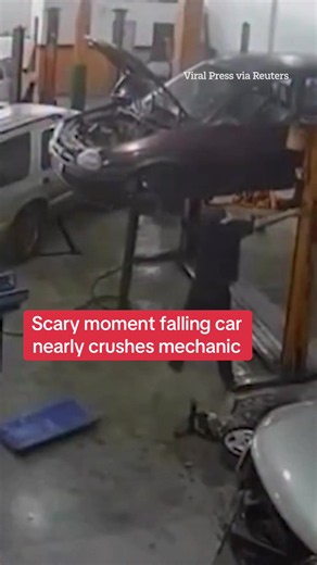 This is the moment a mechanic working on a car in Santa Catarina, Brazil, was almost seriously injured when it crashed to the ground. #Accident #Motors #Brazil #Viral