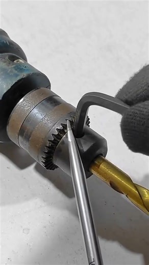 easy way to open a drill bit using a star wrench and screwdriver#shorts