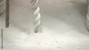 Big bit drilling the ground of a industrial warehouse