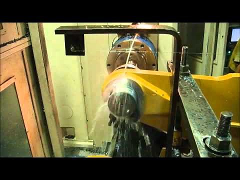 Steiner Autofacer performing back spotface on heavy equipment part