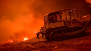 Bulldozer operators give fire crews a fighting chance