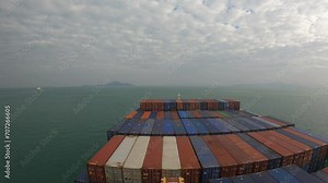 Shekou, China - 09.16.2023 Timelapse of container ship arrive to the port and has loading operations with few gantry cranes in Shekou Container Terminal during.