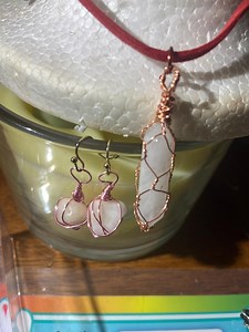 Crystal jewelry pendants, earrings, rings, and key chains wrapped in copper wire.  Perfect gifts accented by special wrapped designs.