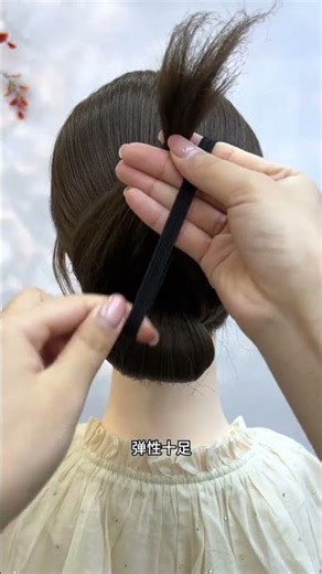 Effortless Elegance: Low Bun and Coat Updo in Under 100 Words