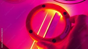 Reflection and refraction of laser beams from mirror. Hand rotates mirror at different angles