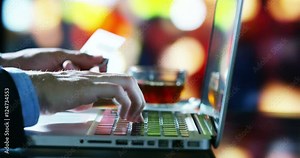 hand typing and touching computer in a moment of relaxation in slow motion