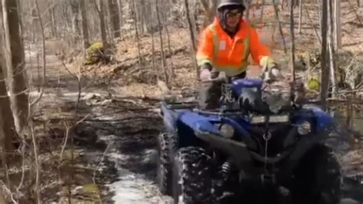 Biker tries to reverse a wheelie and falls backward