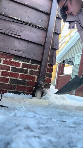 Removing Ice from Gutters After a Snowstorm