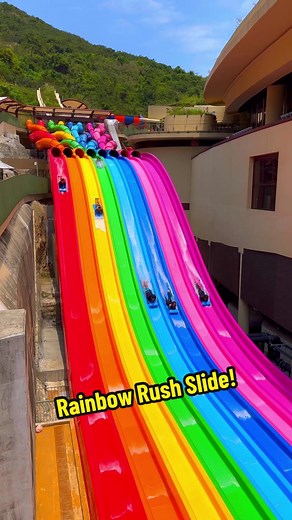 8-lane rainbow rush water slide! 🤯 Would you try this? #waterpark #waterslide #travel