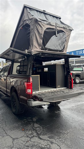 Oregon Outdoor Designs on Instagram: "Had a great couple make the trip up from Bend for an install on their F-150 with a @lonepeakoverland camper. Clean, simple, and purpose-built. This layout features a driver-side bench with two drawers and a large top-access storage cubby, paired with a passenger-side galley with an undermount sink, dedicated Dometic Go mounting and plumbing, and generous pass-through and cabinet storage throughout. Lead times are still short and spring build slots are fillin