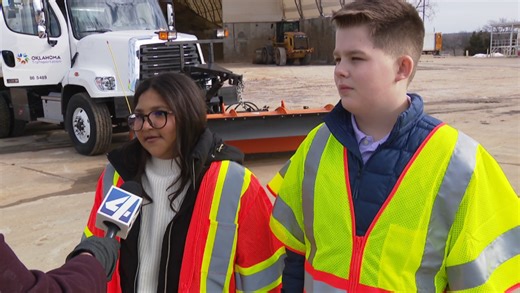 Students who named snow plows tour a truck