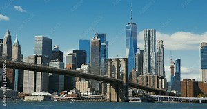 Brooklyn bridge during sunset over Manhattan with Cityscape of New York, USA. 4K time lapse