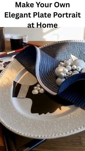 Make Your Own Elegant Plate Portrait at Home Supplies (makes 1 portrait): 1 decorative plate (ceramic or plastic, plain or patterned) Hot glue gun or strong craft glue Fabric scraps, felt, or ribbon (for the hat) Artificial flowers, lace, or beads (for embellishment) Black permanent marker or acrylic paint (for facial details) Scissors Optional: small feathers or tulle for added flair Steps: Prepare the Plate: Clean and dry the plate. If it has a bold design, choose one that complements your the