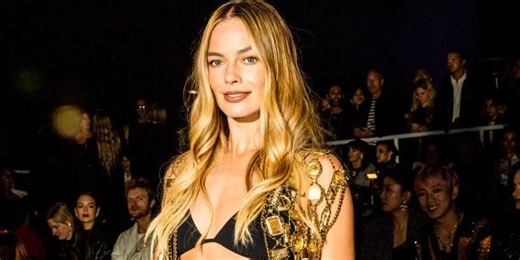 Margot Robbie bared her abs in a bikini top and jeans at Chanel show
