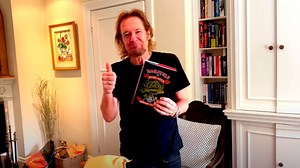 IRON MAIDEN's ADRIAN SMITH Unboxes First Copy Of His Upcoming Fishing Memoir 'Monsters Of River & Rock'
