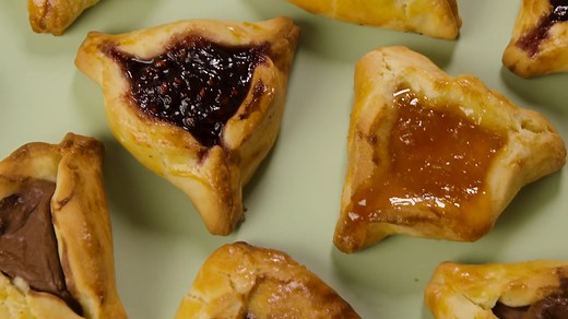 Follow our hamantaschen recipe to make these classic shortbread like cookies filled with jam, traditionally served around the Jewish holiday of Purim. | Delish