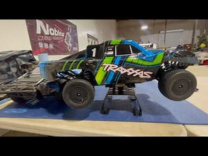 Traxxas Slash Racing On A Clay Track