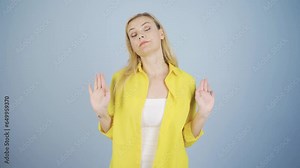Woman keeping silence while looking at camera.