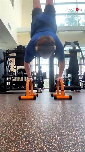 Fitness enthusiast's handstand push-up attempt ends as handlebar gives way