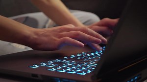 Female hands typing on laptop notebook keyboard sit at home office working online