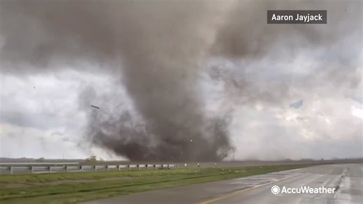 Storm chaser Aaron Jayjack captured this video near Lincoln, Nebraska, as a violent tornado tore across a highway, leaving at least one tractor trailer on its side. | AccuWeather