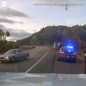 WATCH OUT! A Lincoln County, Wyoming sheriff's deputy and others had a close call during a traffic stop when a passing car lost control after it hit a patch of black ice. No one was injured in the incident. Take a look at this scary moment. | CBS Newspath