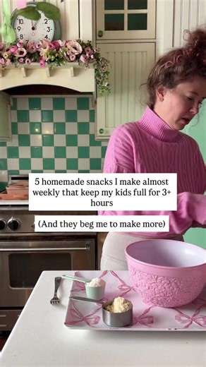 Comment “SNACKS” to get 35 protein packed snack recipes that your kids will love and you’ll love feeding them! 5 homemade snacks I make almost weekly that keep my kids full for 3 hours (and they beg me to make more). Cookie dough bark – tastes like dessert but packed with protein Banana buttons – naturally sweet and so easy to pop in their mouths Healthier peanut butter cookie dough balls – no baking required Chocolate covered strawberry protein bites – their absolute favorite Blueberry clusters