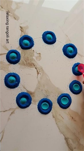 Easy and simple rangoli design| tricky rangoli using spoon #rangoli #relaxingrangoliart