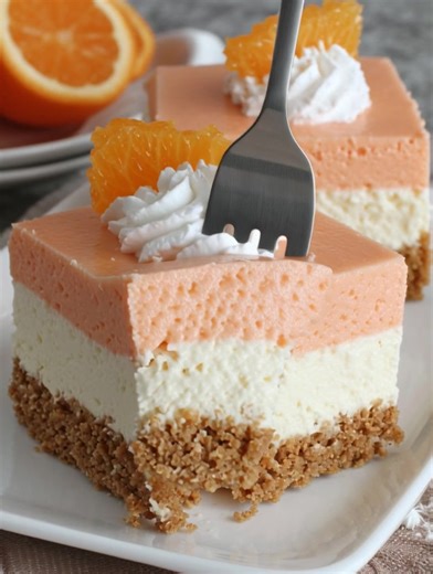 🍊🍰 ORANGE CREAMSICLE DREAM BARS ☁️✨ Creamy orange and cheesecake layers on graham crust for refreshing summer dessert perfection! Ingredients: 2 cups graham cracker crumbs 1/4 cup all-purpose flour ...... Full Recipe in Coʍmеոτ 💬 | The Saucy Plate